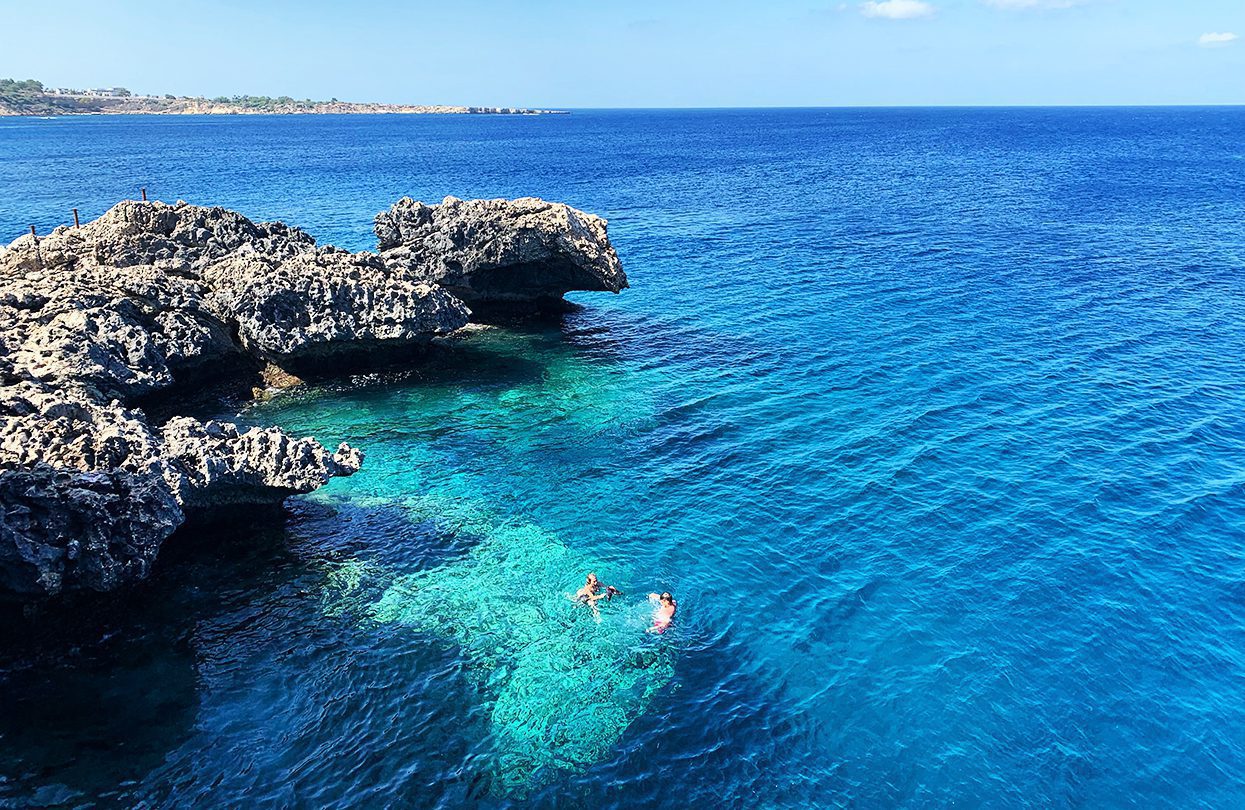 Swimmers taking a dip at Agioi Anargyroi Dive Site in Ayia Napa
