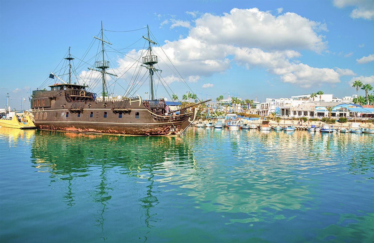 Pirate ship and fishing boats in harbor of Ayia Napa, image by Vladimir Sazonov