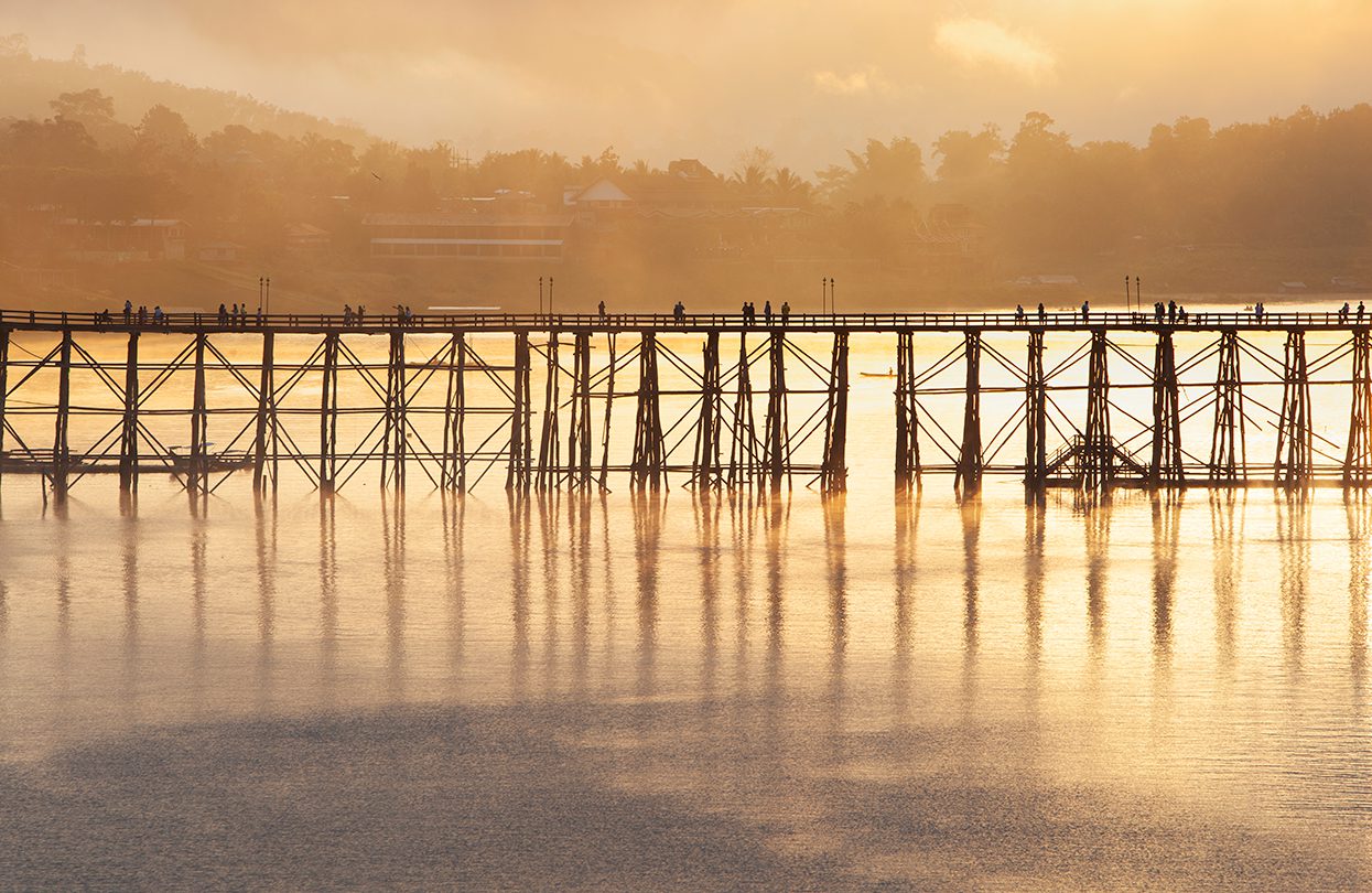 Saphan Mon or Uttamanusorn Bridge is the longest wooden bridge in Thailand, cross the Songkalia River at Kanchanaburi