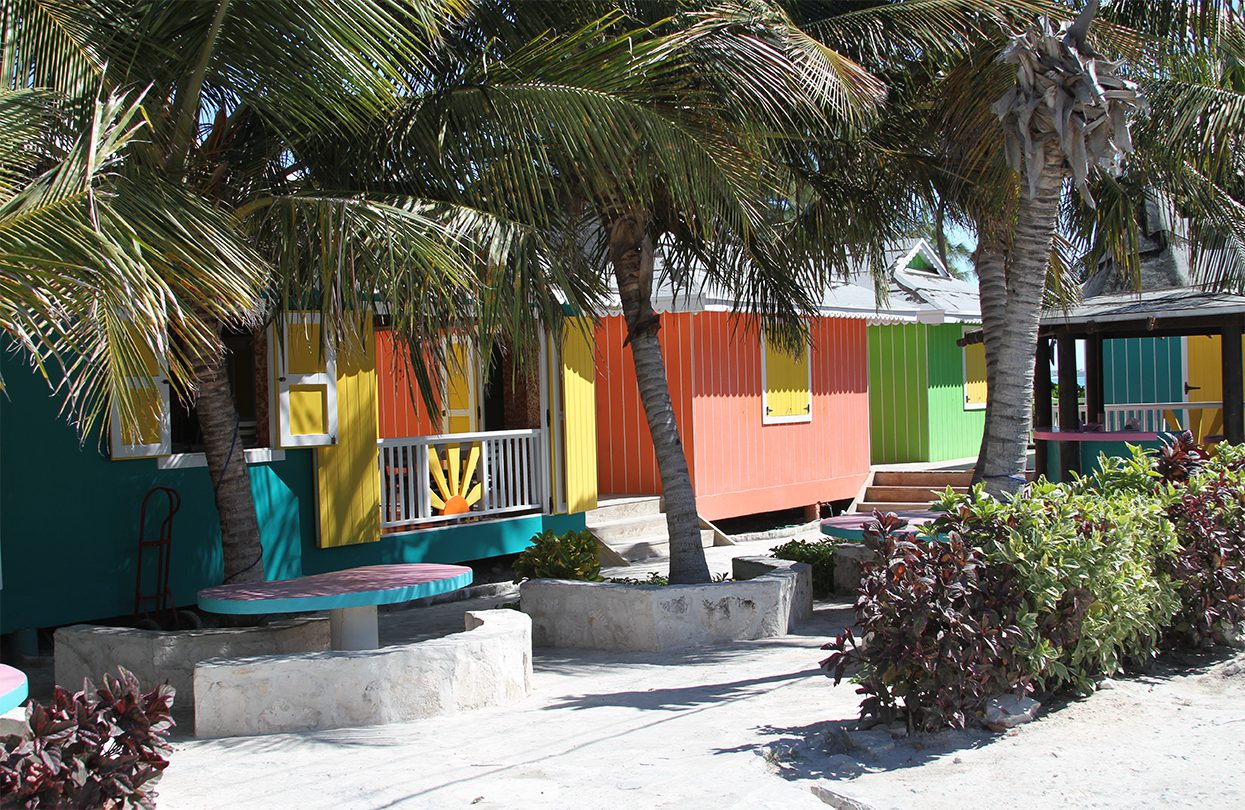 The colorful shops in Blue Hills on Providenciales, the third- largest, most populated island in Turks & Caicos. Providenciales is a reliable favorite for visitors to the Turks and Caicos islands. image by Norman Rogers