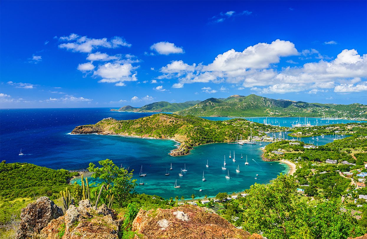 The view from Shirley Heights, Antigua. Shirley Heights is a popular place to visit for tourists and locals alike on Sunday nights to experience live music and rum cocktails while enjoying the sunset, image by Sean Pavone
