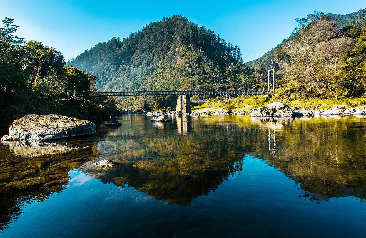 Reflections in the peaceful Karangahake Gorge - a favourite cycling and hiking trail on The Coromandel Peninsula, by Destination Coromandel, Tourism New Zealand