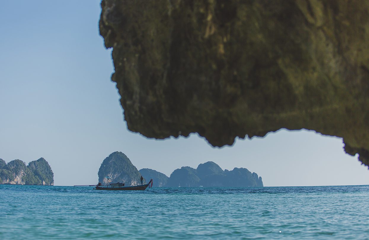 The protruding cliffs hanging precariously over the sea kept us amused as we relaxed on the two trampoline hammocks, Photo - Wan Tse, Simpson Yacht Charter