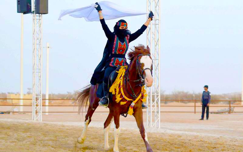 Saudi woman rides a horse during the Souq Okaz Festival in Taif, August 2019, image by AFP Getty Images