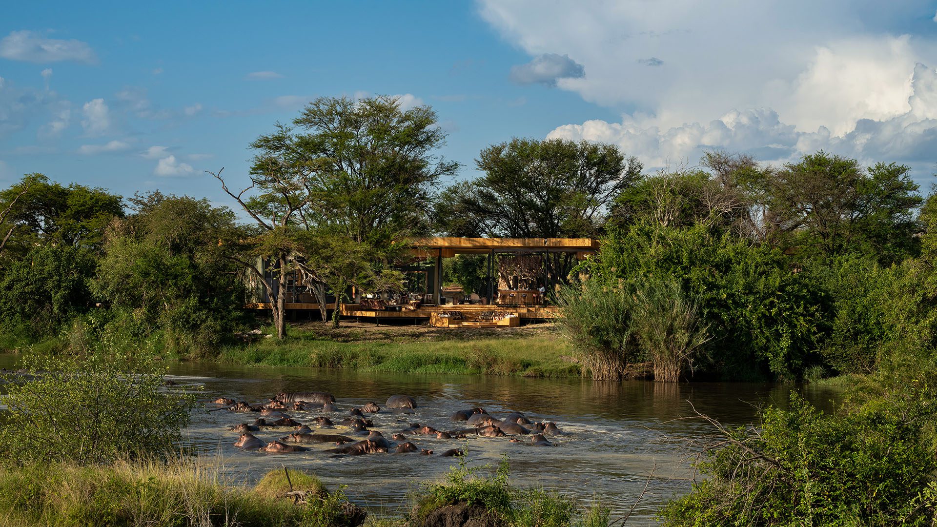 Tanzania Grumeti Serengeti River Lodge exterior with hippo pod