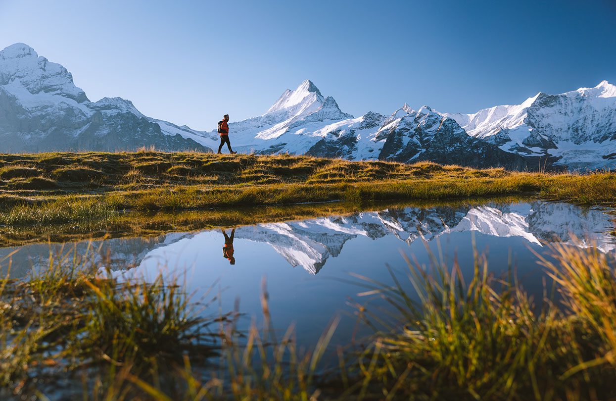 Hiking along the Lake Bachalp, image by David Birri, copyright Jungfrau Region Tourismus AG