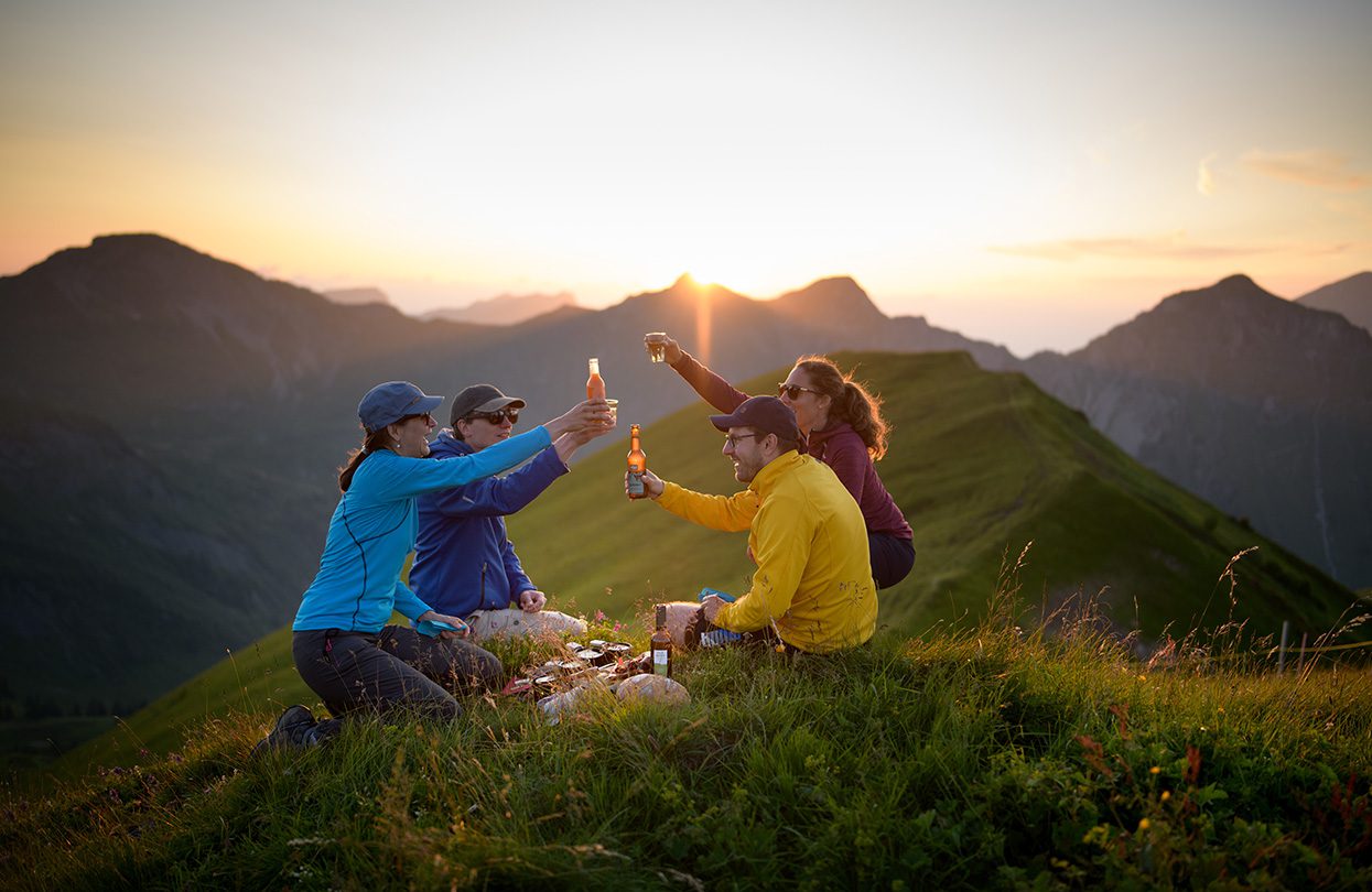As the saying goes ‘After effort comes comfort’, share a delicious raclette on the summit when in Valais, image credit Switzerland Tourism