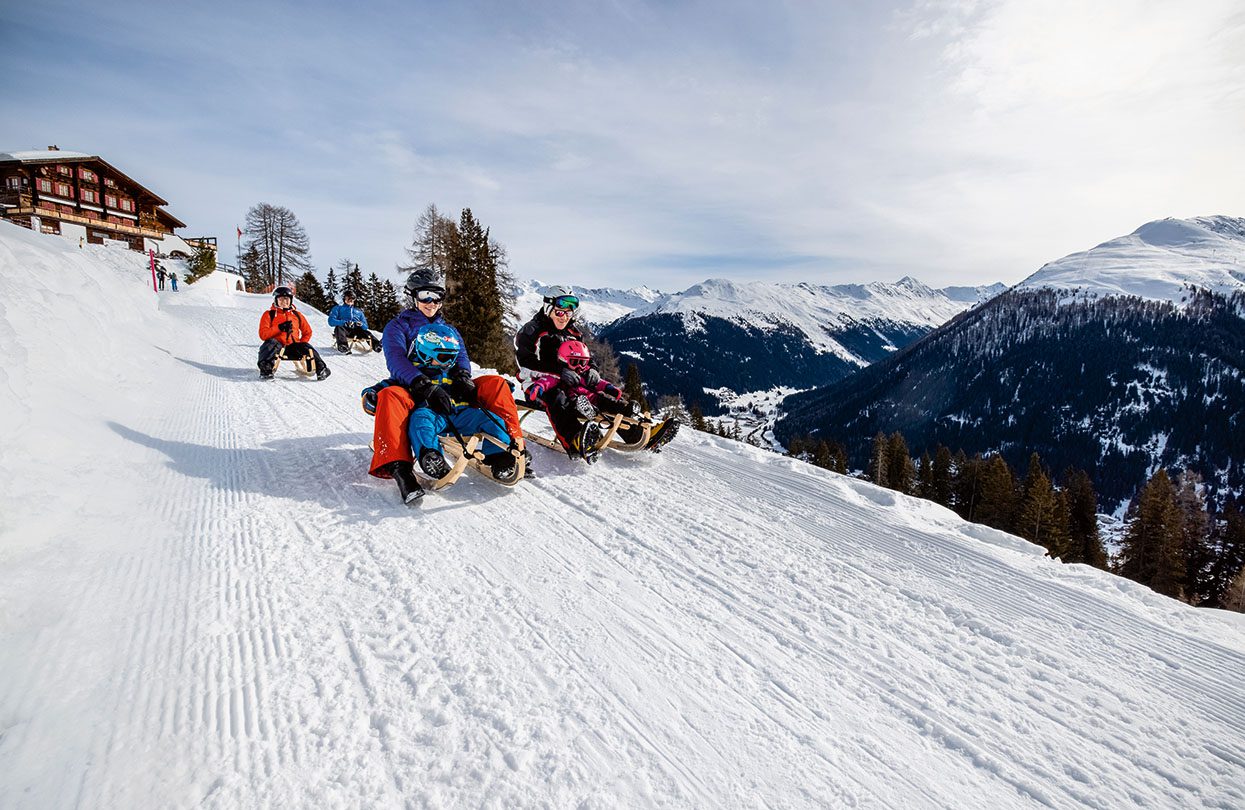 Multi-generational tobogganing in Davos, image by Switzerland Tourism