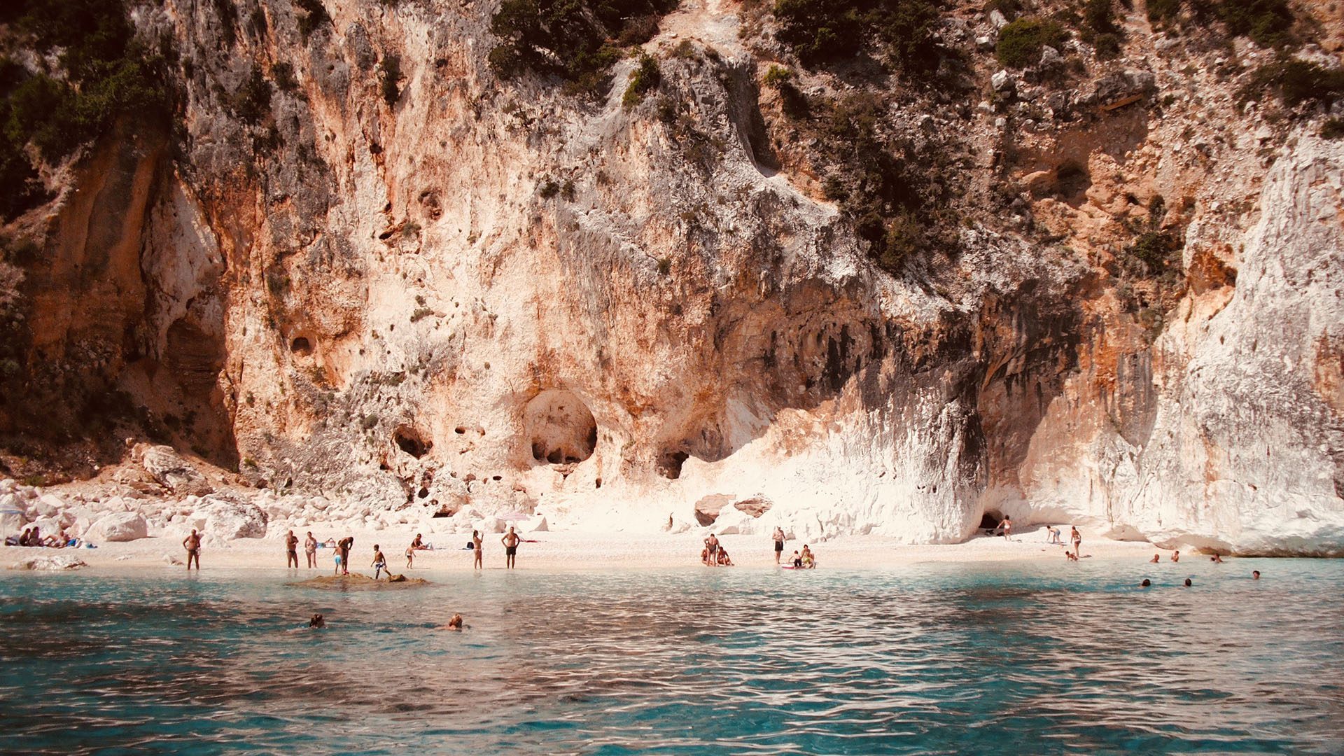 Tourist by the Seashore near Rock Formation, Baunei, Photo by Martina Amaro, Pexels