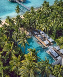 Palm fringed main pool at Vakkaru Maldives
