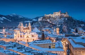 Salzburg Cathedral and famous Festung Hohensalzburg illuminated in beautiful twilight during Christmas, Image by canadastock, shutterstock
