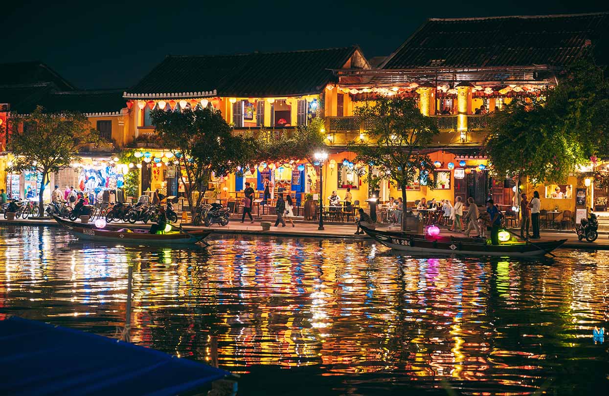 Hoi An ancient town and passenger boats on Thu Bon River, Image by Asia Evtyshok, Shutterstock