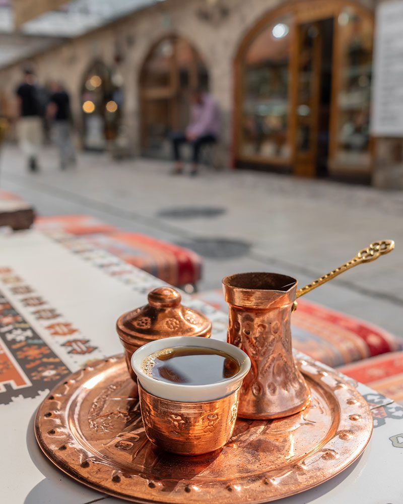 Traditional black bosnian coffee in beautiful copper cezve in Sarajevo, Image by Mazur Travel, Shutterstock